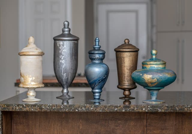 Five Caliva Designs vessels displayed together in a home